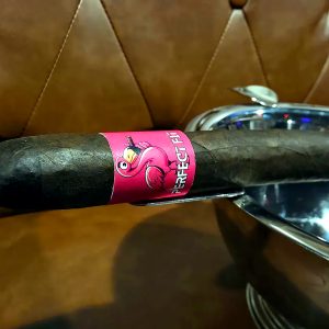Perfect Fit cigar resting on metal ashtray